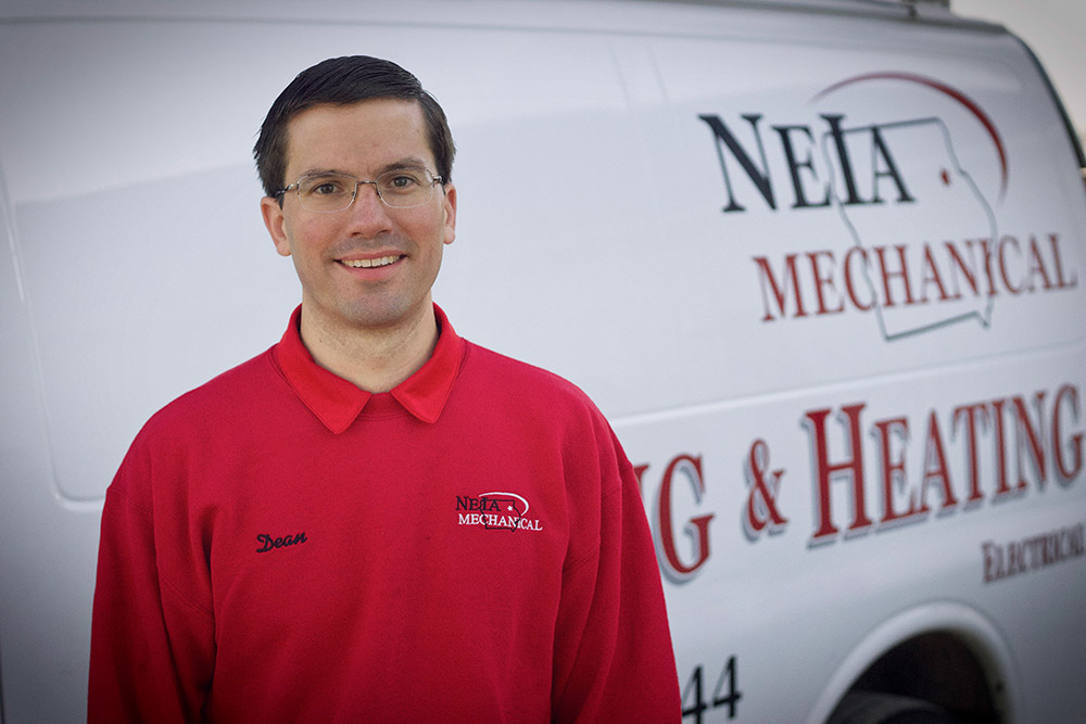 Owner Dean standing in front of the install van
